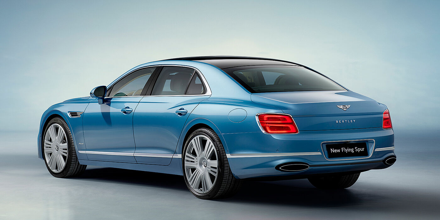 Bentley Glasgow New Bentley Flying Spur Azure sedan rear view in Light windsor blue by Mulliner paint with 22 inch Azure wheels and chrome exterior details