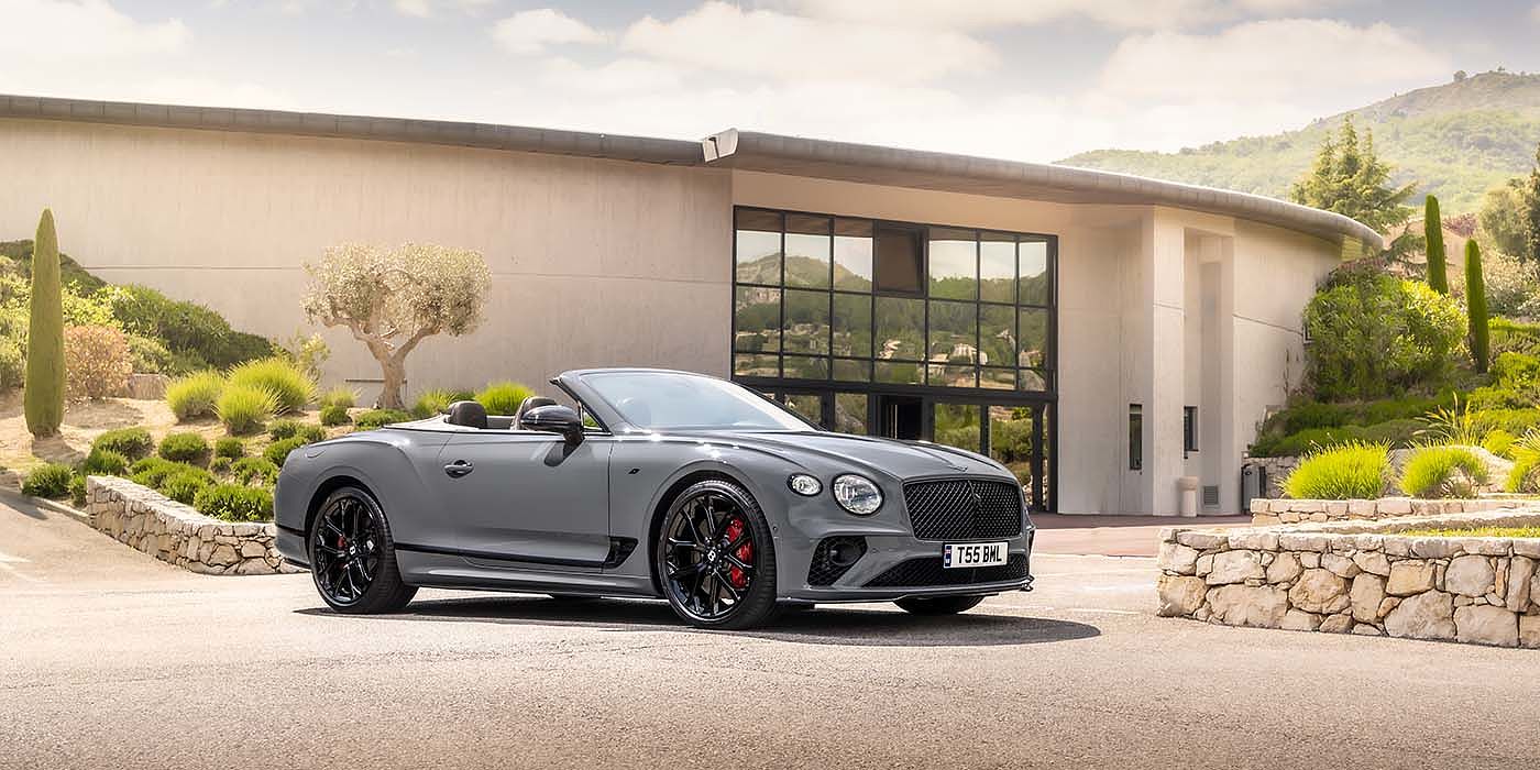 Bentley Glasgow Bentley Continental GTC S convertible in Cambrian Grey paint front 34 static near house