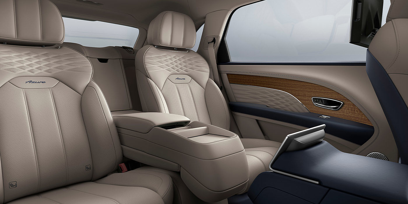 Bentley Glasgow Bentley Bentayga EWB Azure interior view for rear passengers with Portland hide featuring Azure Emblem in Imperial Blue contrast stitch.
