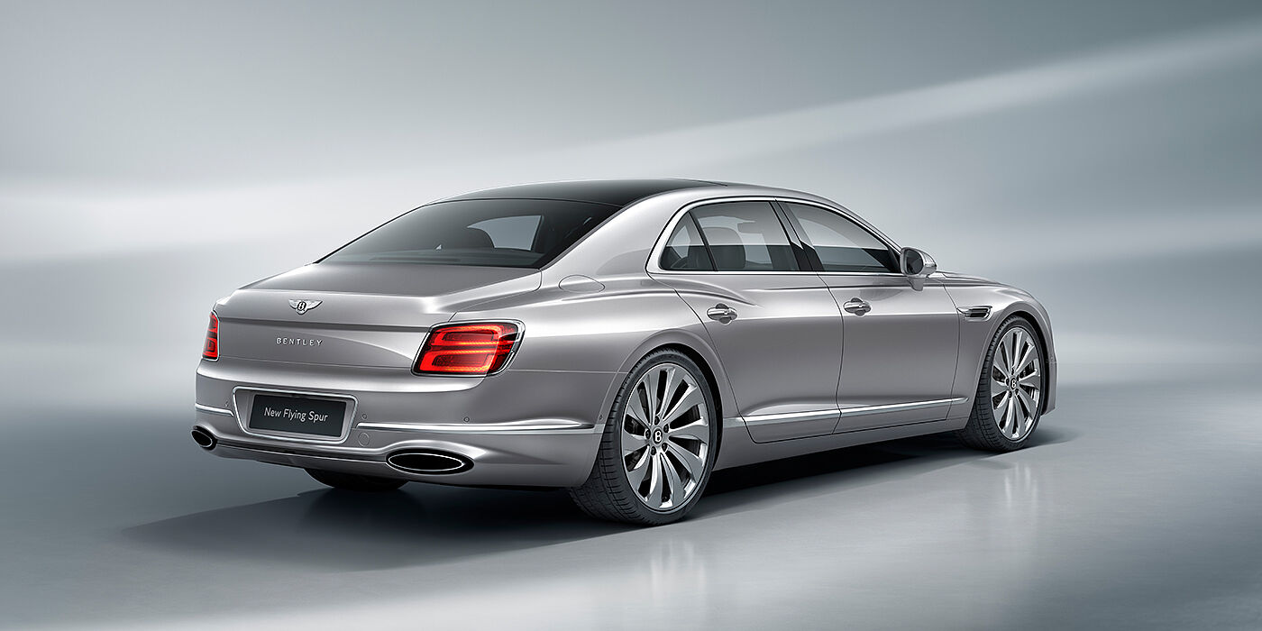 Bentley Glasgow New Bentley Flying Spur sedan rear view in Silverlake paint with ten spoke wheels and chrome matrix grille