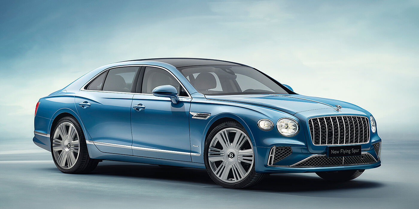 Bentley Glasgow New Bentley Flying Spur Azure sedan front view in Light windsor blue by Mulliner paint with 22 inch Azure wheels and chrome exterior details