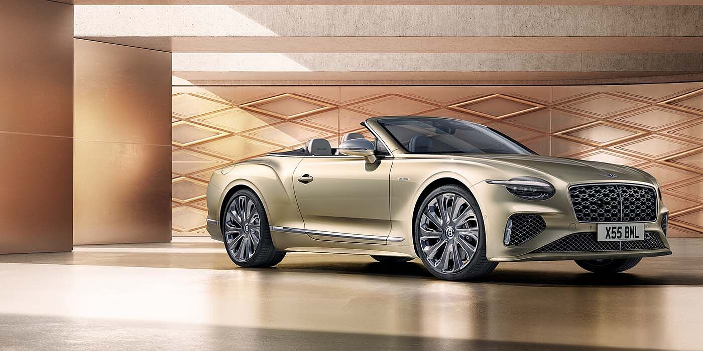 Bentley Glasgow Bentley New Continental GTC Mulliner V8 hybrid front three quarters in Patina paint