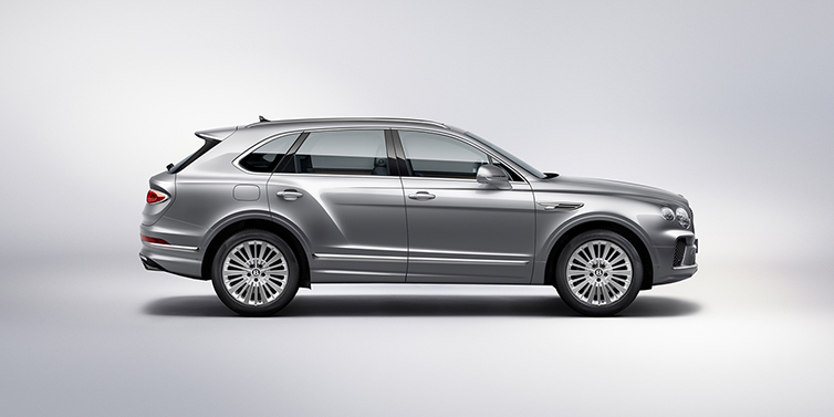 Bentley Glasgow Bentley Bentayga SUV side profile in Moonbeam silver paint against white background featuring 21 inch 5 spoke wheels