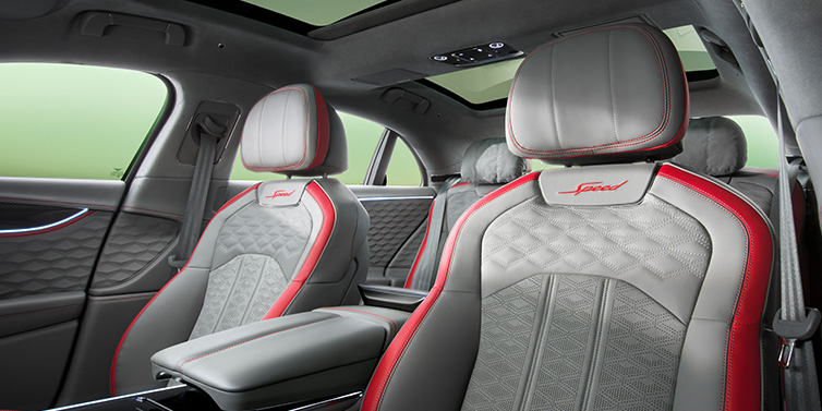 Bentley Glasgow Bentley Flying Spur Speed sedan interior showing front and rear seats in Hotspur red and Gravity Grey hides, with Speed seat emblems